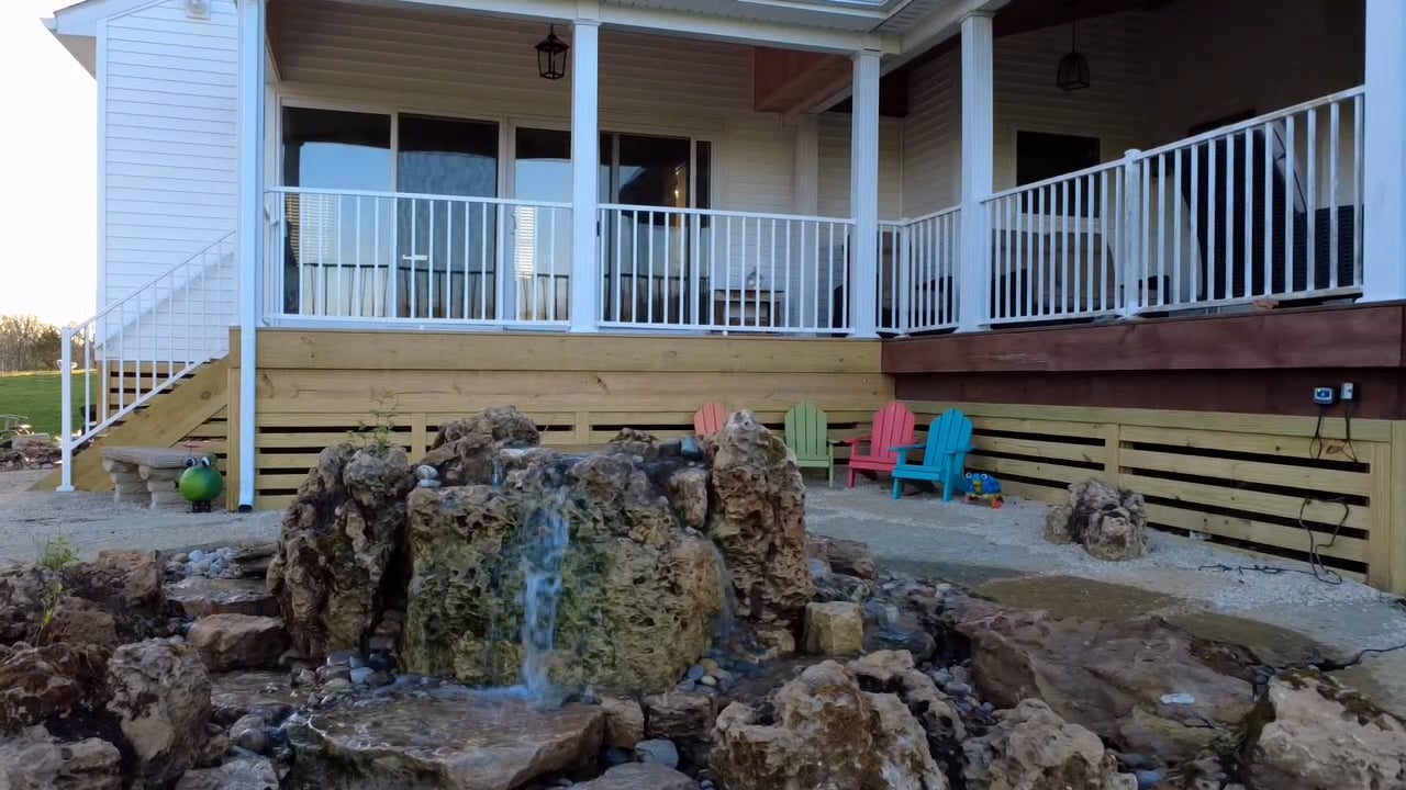 Waterfall water feature set into limestone boulders at a west side Cincinnati home