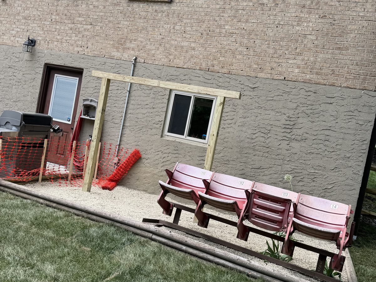 Eroding hillside behind a west side Cincinnati home before a retaining wall was built