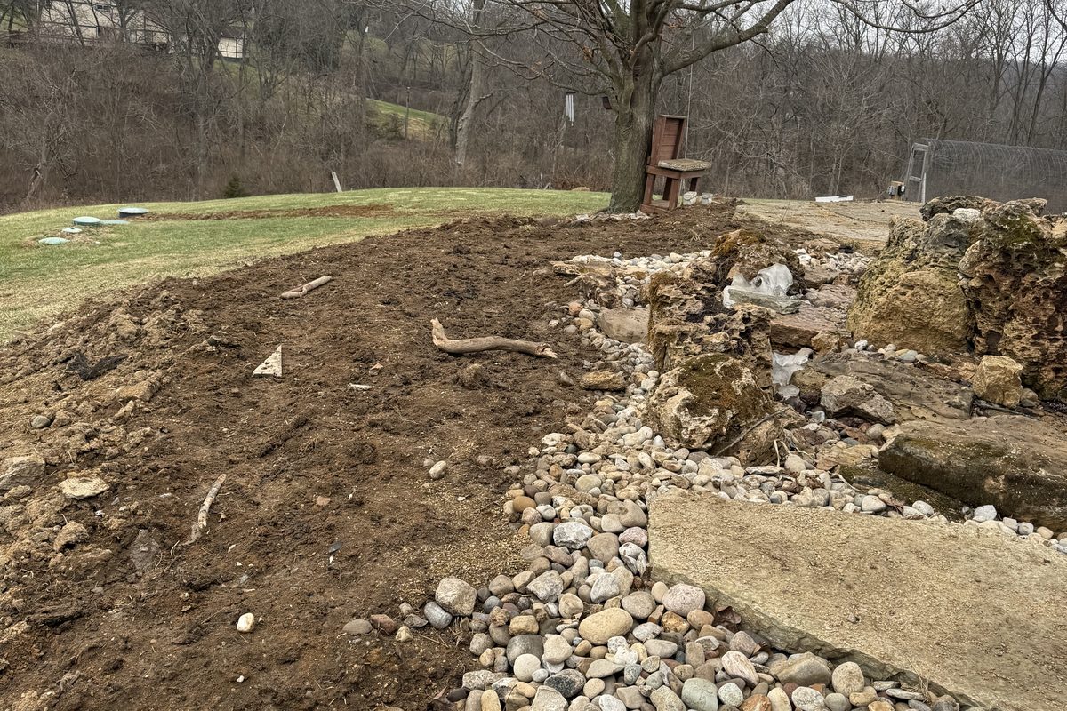 French drain installation solving standing water in a west side yard
