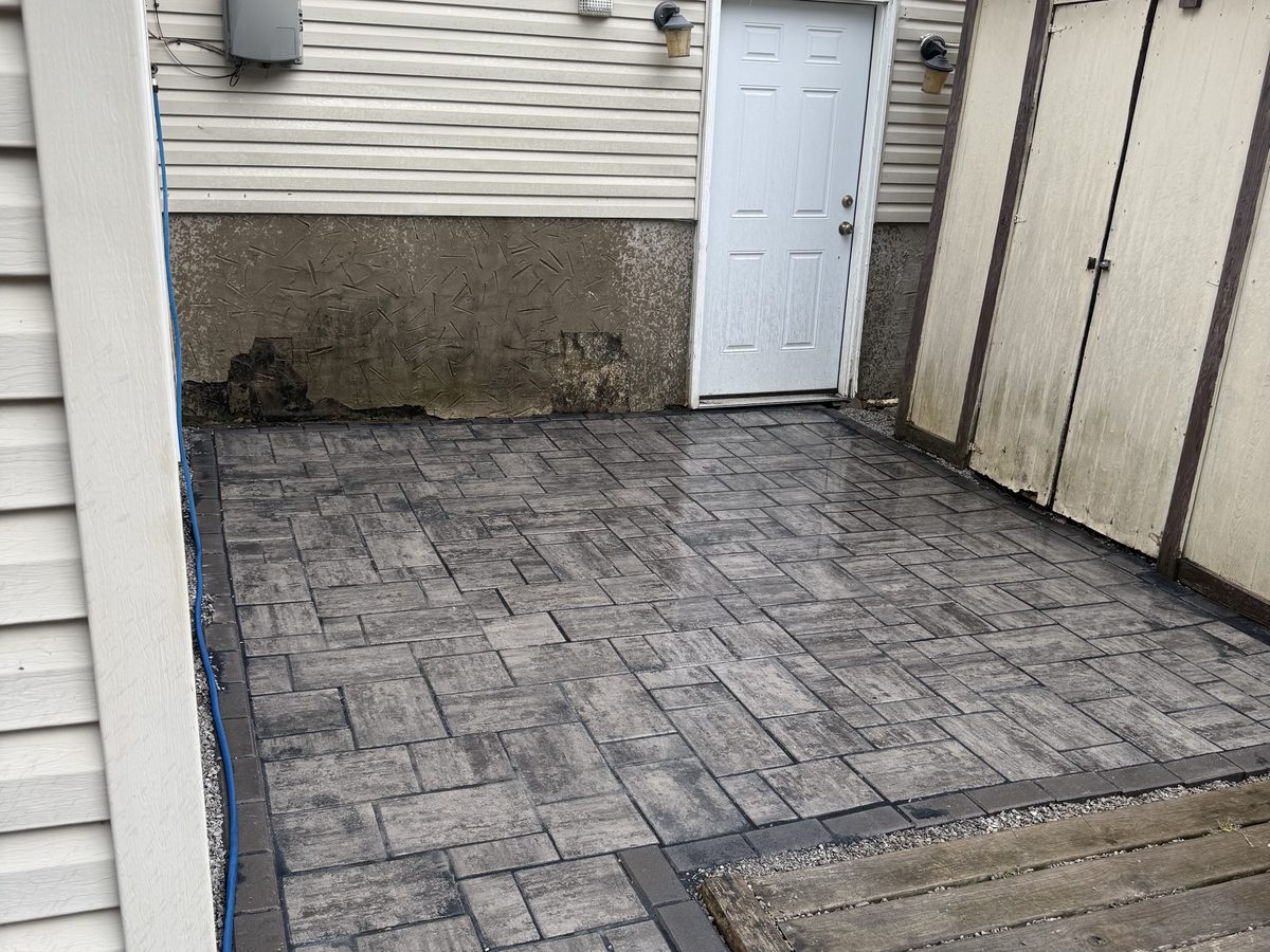 Finished paver patio cut level into a west side Cincinnati hillside