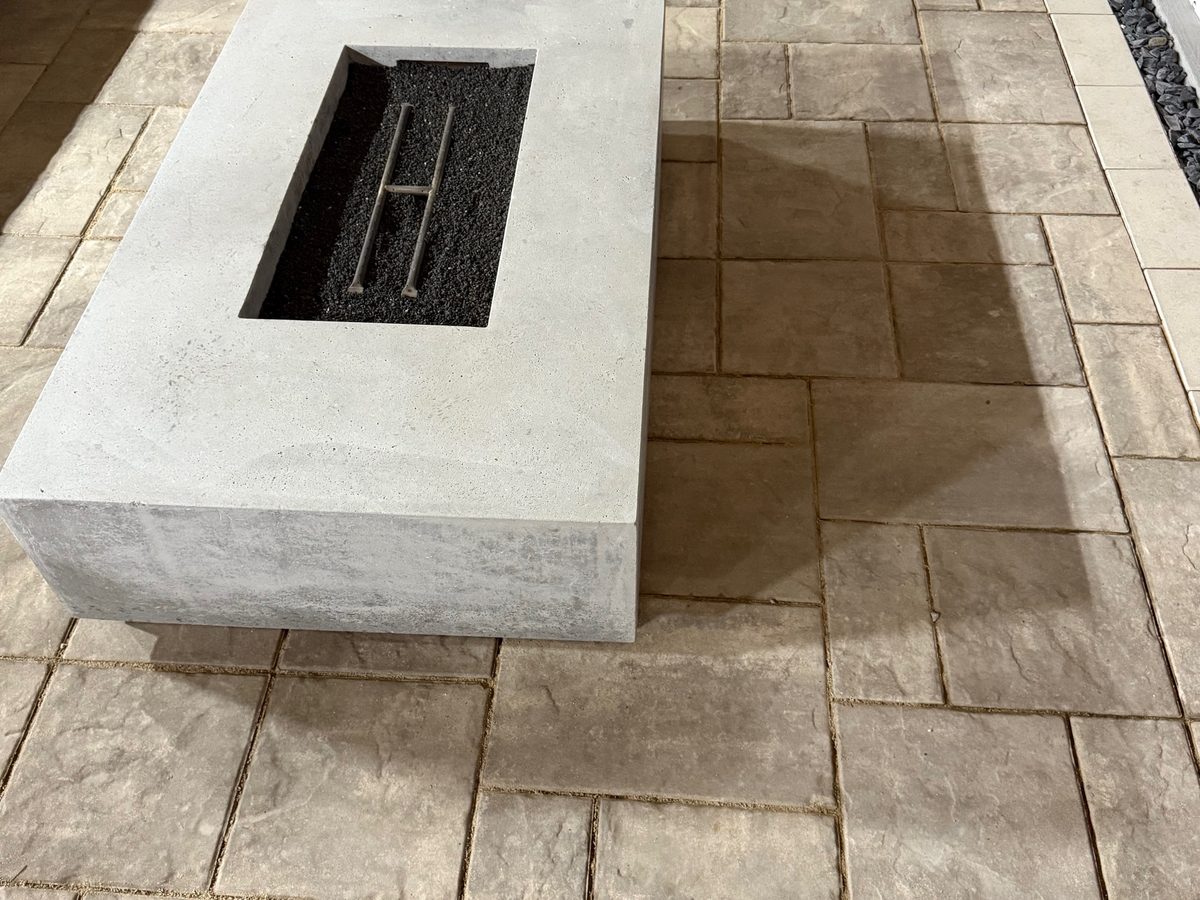 Paver patio installation on a sloped backyard in Cincinnati's west side